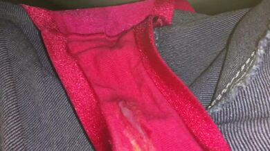 Slim girl in jeans pisses in a public toilet and shows dirty panties