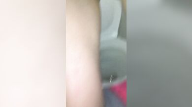 Slim girl in jeans pisses in a public toilet and shows dirty panties