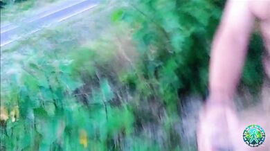 Risky, naked on a busy road, flashing penis at cars.