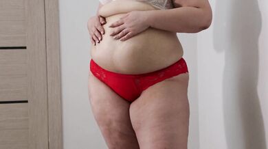 BBW shakes stuffed belly and fat ass in panties. Fetish.