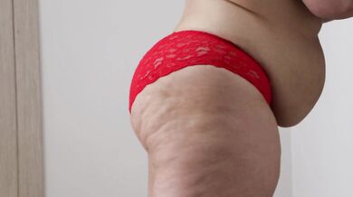 BBW shakes stuffed belly and fat ass in panties. Fetish.