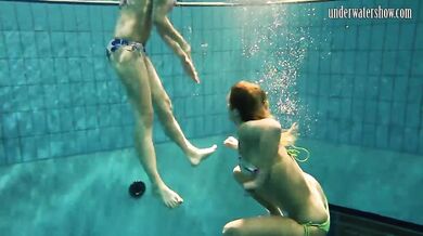 Girls Andrea and Monica stripping one another underwater