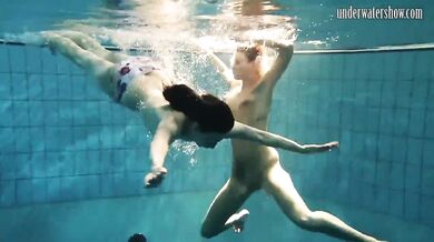 Girls Andrea and Monica stripping one another underwater
