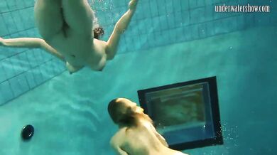 Girls Andrea and Monica stripping one another underwater