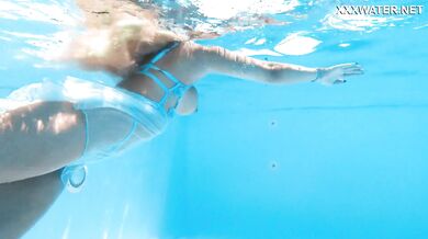 Hot milf pornstar Lisi swimming naked in the pool