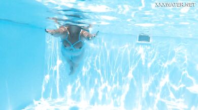 Hot milf pornstar Lisi swimming naked in the pool