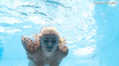 Hot milf pornstar Lisi swimming naked in the pool