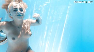 Hot milf pornstar Lisi swimming naked in the pool