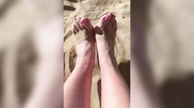 bare feet on a sandy beach