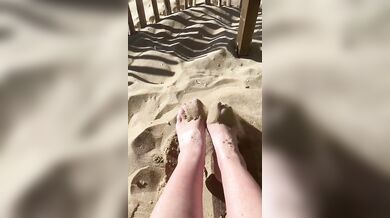 bare feet on a sandy beach