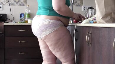 bbw housewife with big belly and big ass in the kitchen in panties