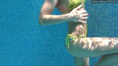 Cute wifey gets naked quickly in the pool