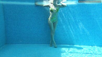 Cute wifey gets naked quickly in the pool