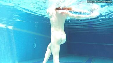 Cute wifey gets naked quickly in the pool