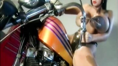 Brunette with big boobs on bike