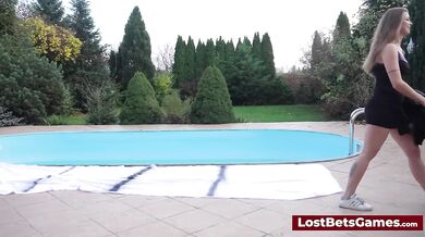 A sexy busty redhead is riding a sybian sex toy after winning a wrestling match