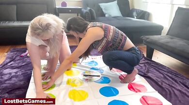 Two horny lesbians playing a twister game before inserting sex toys