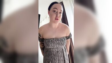 Beautiful brunette in a dress shaking her big tits