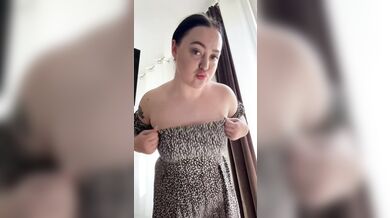 Beautiful brunette in a dress shaking her big tits