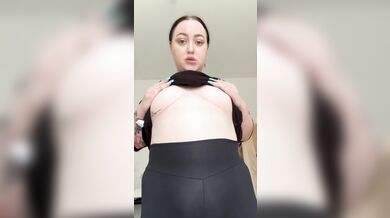 Beautiful brunette shakes her half-naked big tits