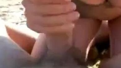 Big titty blowjob on the beach