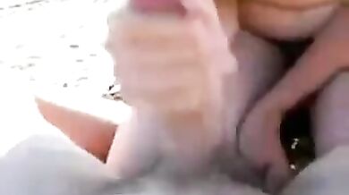 Big titty blowjob on the beach