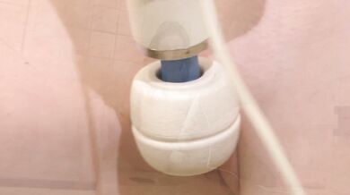 Brunette plays with herself in the shower