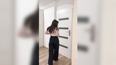 Pretty girl in white squeezes her tits.