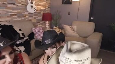 Three Cowgirls Ready To Blow On A Big Old Thunderock and they really do