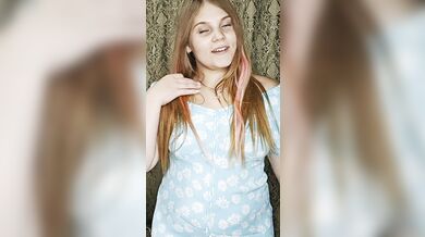 a redheaded hottie in an arousing blue dress.