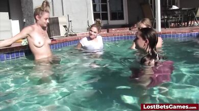 A guy enjoying being sucked and fucked in the pool by several hot babes