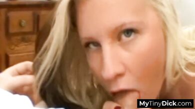 Busty blonde sucking and fucking his small cock with her big boobs