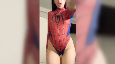 a beautiful girl in a spider-man costume