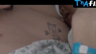 Alice Isaaz Breasts Scene in Elle