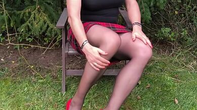 Sexy MILF in the garden