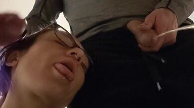 pixie with her fat tongue out waits next to Master while He's pissing then licks the dripping tip