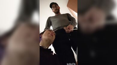 pixie with her fat tongue out waits next to Master while He's pissing then licks the dripping tip