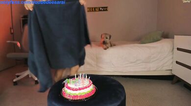 Latina sits on a cake for her birthday 7709A9