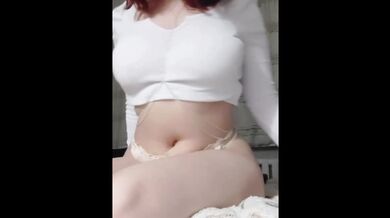 The woman moves her body sexily in ecstasy.