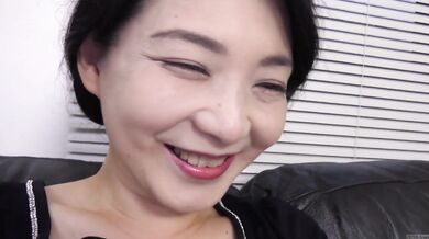 Mature and married Japanese woman with pale skin and a few random gray pubic hairs among a sea of black secret JAV debut