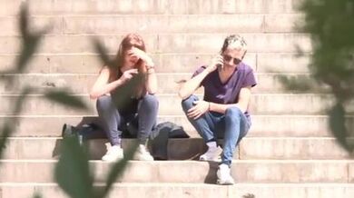 Brunette young girl gets caught in the street