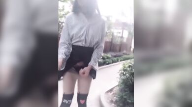 Exhibicionist Asian Ladyboy selfie stick videos flashing her cock on the street
