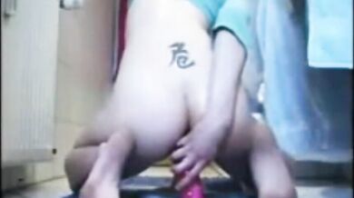 Slut drives her substantial red dildo